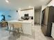 Bright open kitchen with island seating, stainless steel appliances and a clean design at 4295 Twisted Twig Bnd, Kissimmee, FL 34746