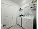 Functional laundry room featuring a washer, dryer, and ample natural light at 4295 Twisted Twig Bnd, Kissimmee, FL 34746