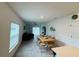 Open-concept living space with dining area, modern decor, and plenty of natural light at 4295 Twisted Twig Bnd, Kissimmee, FL 34746