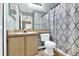 Functional bathroom with a single sink vanity, toilet, and shower with patterned curtain at 4356 S Kirkman Rd # 514, Orlando, FL 32811