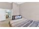Neutral bedroom with a bed, crib, and ensuite bathroom access at 4356 S Kirkman Rd # 514, Orlando, FL 32811
