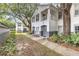 Condo exterior surrounded by trees and greenery, showcasing the building's architecture and location at 4356 S Kirkman Rd # 514, Orlando, FL 32811