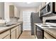 Efficient kitchen with updated countertops and appliances creates a functional and stylish space at 4356 S Kirkman Rd # 514, Orlando, FL 32811