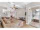 Open-concept living area with kitchen view, couch, and sliding glass door leading to balcony at 4356 S Kirkman Rd # 514, Orlando, FL 32811