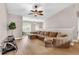 Spacious living room with hardwood floors, neutral walls, and a comfortable sectional couch at 4356 S Kirkman Rd # 514, Orlando, FL 32811
