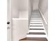 Bright staircase with wood steps, white risers, and handrail creating a modern, clean design at 4356 S Kirkman Rd # 514, Orlando, FL 32811