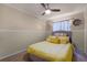 Well-lit bedroom featuring a ceiling fan, light-colored walls, and comfortable bed at 4523 Wyndcliff Cir, Orlando, FL 32817