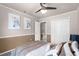 This bedroom features calming colors, stylish wall decor, and ample closet space at 4523 Wyndcliff Cir, Orlando, FL 32817