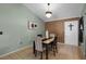Cozy dining room showcasing a table with chairs and paneled walls at 4523 Wyndcliff Cir, Orlando, FL 32817