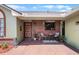 Inviting front porch with brick accents, perfect for relaxing outdoors at 4523 Wyndcliff Cir, Orlando, FL 32817
