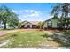 Charming single-story home with a spacious front yard and mature landscaping at 4523 Wyndcliff Cir, Orlando, FL 32817