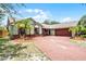 Beautifully landscaped front yard featuring a circular brick driveway at 4523 Wyndcliff Cir, Orlando, FL 32817