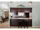 Stylish kitchen bar overlooking the dining area and seamlessly connecting living spaces at 4523 Wyndcliff Cir, Orlando, FL 32817