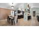 Bright kitchen and dining area featuring dark cabinets and a breakfast bar at 4523 Wyndcliff Cir, Orlando, FL 32817