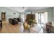 Bright living room featuring a fireplace and access to outdoor spaces at 4523 Wyndcliff Cir, Orlando, FL 32817