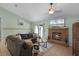 Comfortable living room with a fireplace and access to outdoor patio at 4523 Wyndcliff Cir, Orlando, FL 32817