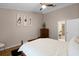 Comfortable main bedroom with a ceiling fan and natural light from the windows at 4523 Wyndcliff Cir, Orlando, FL 32817