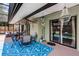 Relaxing covered patio complete with ceiling fan, furniture, and access to the pool at 4523 Wyndcliff Cir, Orlando, FL 32817
