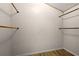 Walk-in closet featuring hardwood floors and plenty of space for storage at 4523 Wyndcliff Cir, Orlando, FL 32817