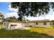 Spacious backyard with a patio, partial fence, and healthy green grass at 500 Vereen Dr, Maitland, FL 32751