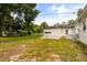 The backyard features a grassy lawn and back view of the single story house at 500 Vereen Dr, Maitland, FL 32751