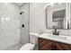 This bathroom features a tiled shower, toilet, and vanity with sink and mirror at 500 Vereen Dr, Maitland, FL 32751