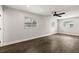 This bedroom features sleek wood flooring, a ceiling fan, and several windows at 500 Vereen Dr, Maitland, FL 32751