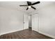 This bedroom features sleek wood flooring, a ceiling fan, and two closets at 500 Vereen Dr, Maitland, FL 32751