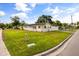 Inviting single story home with a manicured lawn, lush landscaping and an attached garage at 500 Vereen Dr, Maitland, FL 32751