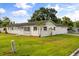Charming single story home with a manicured lawn, lush landscaping and an attached garage at 500 Vereen Dr, Maitland, FL 32751