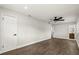 This main bedroom features sleek wood flooring, a ceiling fan, and a full bathroom at 500 Vereen Dr, Maitland, FL 32751
