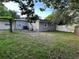 Spacious backyard with mature trees and a fence at 603 Zinnia Dr, Casselberry, FL 32707