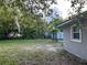 Large backyard featuring mature trees and landscaping at 603 Zinnia Dr, Casselberry, FL 32707