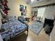 A bedroom is decorated with fun posters, a blue rug, and ample space at 603 Zinnia Dr, Casselberry, FL 32707