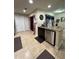 Kitchen featuring a central island with a sink and a stainless steel dishwasher at 603 Zinnia Dr, Casselberry, FL 32707