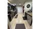 Spacious kitchen featuring stainless steel appliances, tile flooring, and ample storage space at 603 Zinnia Dr, Casselberry, FL 32707
