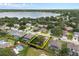 Neighborhood aerial view near the lake with houses surrounded by trees at 813 Lancer Cir, Ocoee, FL 34761