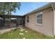 Home exterior featuring a screened-in patio at 813 Lancer Cir, Ocoee, FL 34761