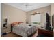 Bedroom featuring a bed, blinds, and a ceiling fan at 813 Lancer Cir, Ocoee, FL 34761