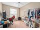 Bedroom with ceiling fan, window, desk, and assorted items at 813 Lancer Cir, Ocoee, FL 34761