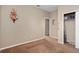 A secondary bedroom featuring a neutral color palette and minimal furnishings at 813 Lancer Cir, Ocoee, FL 34761