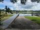 Boat ramp leading into a picturesque lake, offering easy access for water activities and scenic views at 813 Lancer Cir, Ocoee, FL 34761