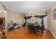 Dining area featuring wood floors, an exercise bike, and a chandelier at 813 Lancer Cir, Ocoee, FL 34761