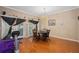 Dining room with wood floors, chandelier, and an exercise bike at 813 Lancer Cir, Ocoee, FL 34761