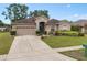 Charming one-story home with a well-manicured lawn and a two-car garage at 813 Lancer Cir, Ocoee, FL 34761