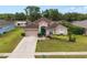 Beautiful one-story home with a manicured lawn and a two-car garage at 813 Lancer Cir, Ocoee, FL 34761