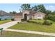 Charming home with well-manicured landscaping and attached two-car garage at 813 Lancer Cir, Ocoee, FL 34761