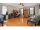 Spacious living room with hardwood floors, a ceiling fan, and neutral-toned walls at 813 Lancer Cir, Ocoee, FL 34761