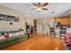 Open concept living room with hardwood floors flowing into kitchen and dining area at 813 Lancer Cir, Ocoee, FL 34761