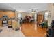 Open concept living room featuring hardwood floors, ceiling fan, and natural light at 813 Lancer Cir, Ocoee, FL 34761